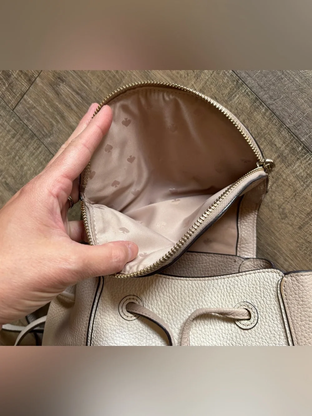Kate Spade women’s Leila Medium Flap Backpack beige cream pebbled leather purse
